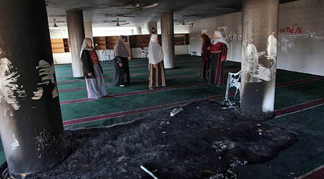 إدانة قطرية بحرينية لعملية إحراق مسجد وكنيسة بفلسطين