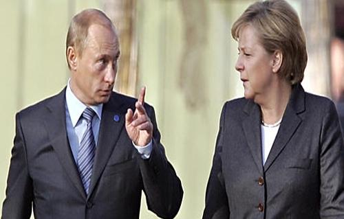 ميركل تطالب الرئيس الروسي بوقف تدفق الأسلحة الى أوكرانيا